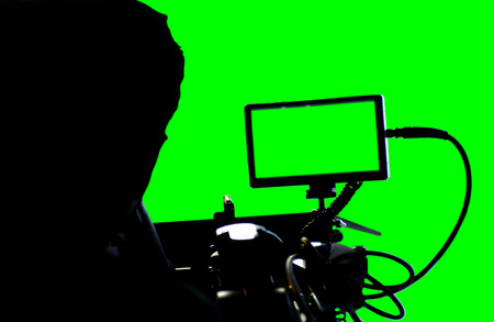 Movie camera with green screen.の写真素材