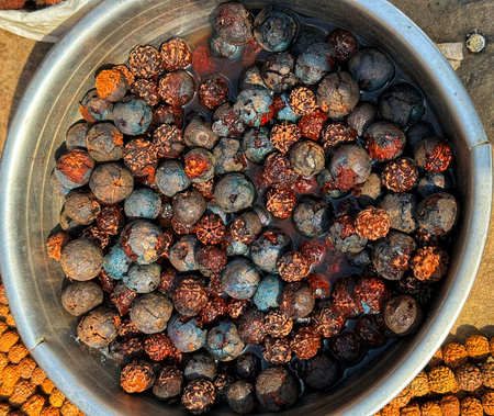 Dried fruits in a metal bowl, top view, close-upの写真素材