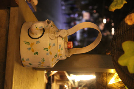 Ceramic teapot in a restaurant in the evening.の写真素材