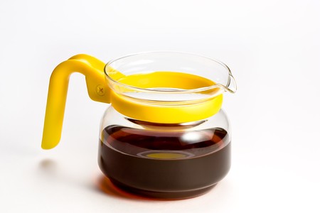 a glass tea pot isolated over whiteの写真素材