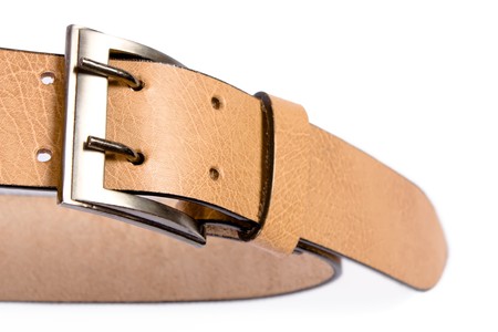 A yellow  leather belt isolated on white backgroundの写真素材