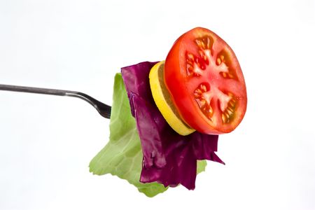 Collection of cutting tomato lemon beetroot and cabbage in forkの写真素材