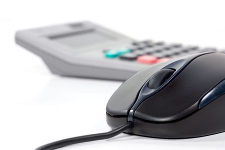 Black computer mouse  and calculator  in white backgroundの写真素材