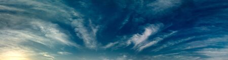 Snow dark clouds panorama in blue sky の写真素材