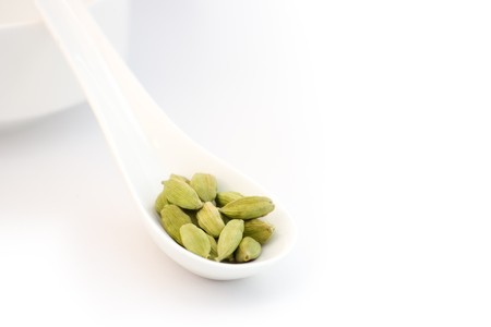 Group of cardamom pads on white background white spoon の写真素材