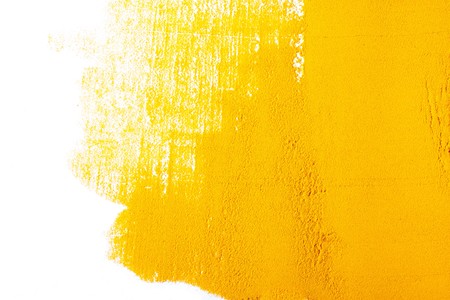 Yellow Texture made from turmeric isolated on white backgroundの写真素材