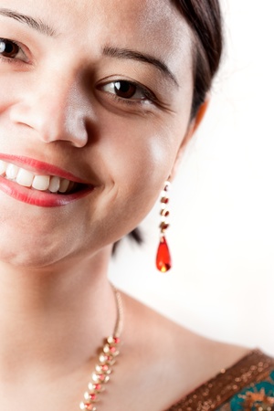 Smiling Indian happy woman over white backgroundの写真素材