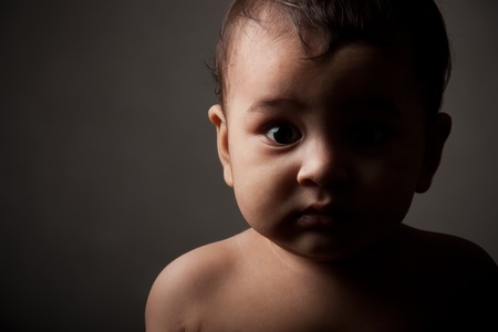 Surprised indian baby boy in poseの写真素材