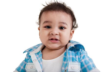 Adorable Indian baby laughing a over white background