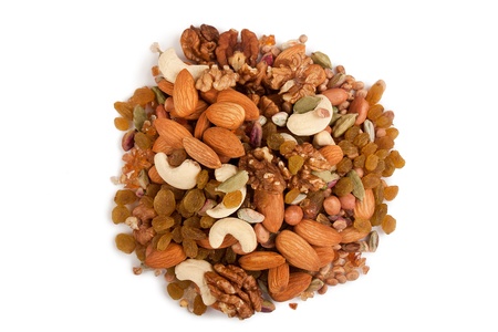 Pile of mix collection of dry fruits isolated over whiteの写真素材