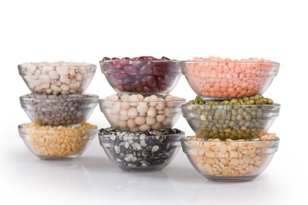 Grains pulses and beans in bowl isolated over white overの写真素材