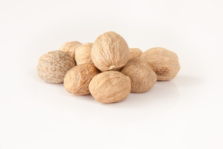Collection of nutmeg over white backgroundの写真素材