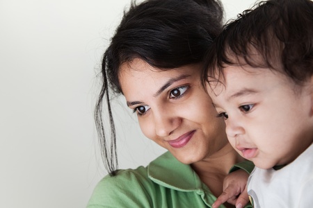 Indian Happy mother and baby looking at othersの写真素材