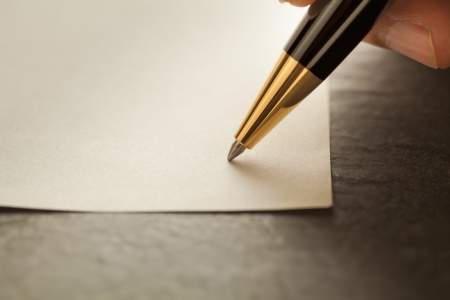 Close-up shot of  a pen on the white paperの写真素材