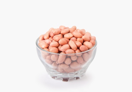 Collection of red groundnuts pods on white background