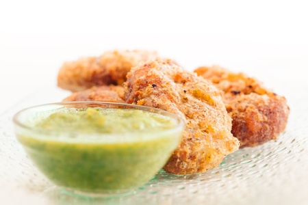 Chicken or potato cutlet with chilli sauce over white