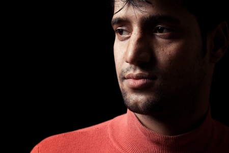 Grains   textures are added in the portrait of Indian man over dark backgroundの写真素材