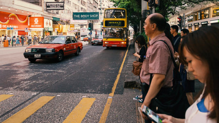 People waiting for the bus Tsim Sha Tsui Hong Kong China 21 June 2013.