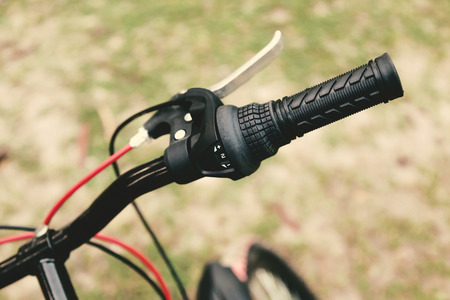Close up of a red and black mountain bicycle handle.の写真素材