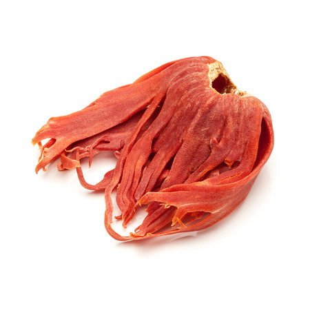 Macro closeup of Organic Mace or jayitri Myristica fragrans isolated on white background.