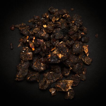 Top view of Organic Indian bdellium or Guggul resin Commiphora wightii isolated on dark background.の写真素材