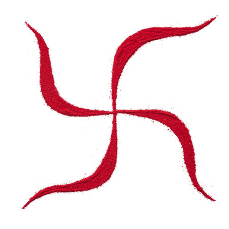 Top view close up of red color swastik rangoli symbol isolated on white background.の写真素材