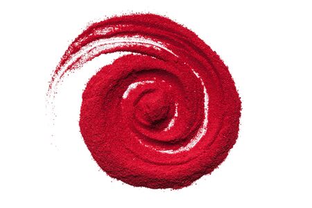 Top view close up of red color spiral made of soil on white background.の写真素材