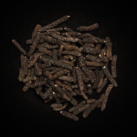 Top view of Organic Long pepper Dried Fruit Piper longum isolated on dark background.の写真素材