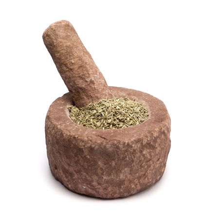 Organic Fennel seed Foeniculum Vulgare in mortar with pestle, isolated on white background.の写真素材