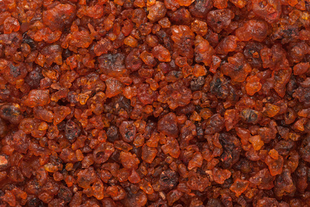 Organic Natural treated (washed) Gum Lac Resin produced by Kerria lacca insect. Macro close up background texture. Top view.の写真素材