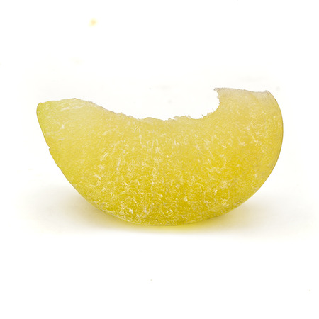 A slice of a Organic Indian gooseberry or Amla (Phyllanthus emblica) isolated on white background.の写真素材
