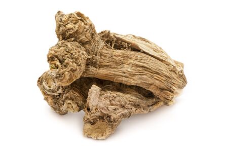 Organic dry Horseradish (Armoracia rusticana) roots isolated on white background. Macro close up. Top view.の写真素材