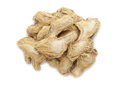 Organic dry Ginger root or Sonth (Zingiber officinale) isolated on white background. Macro close up. Top view.の写真素材