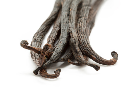 Organic dry sticks of Vanilla (Vanilla planifolia) isolated on white background. Macro close up. Front view.の写真素材