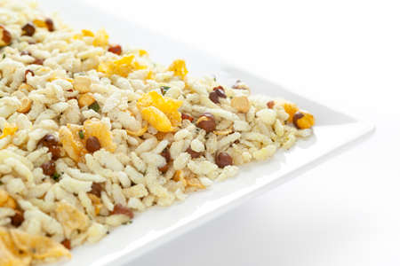 Crunchy Diet Lite Mixture in a white ceramic square plate made with Puffed Rice, Corn Flakes, and...