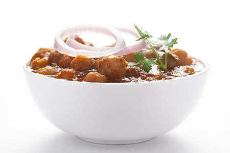 Chickpeas masala (Spicy chola or chhole curry)  garnished with fresh green coriander and...