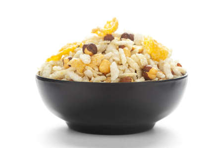Close-Up of Crunchy Diet Mixture in a black Ceramic bowl made with Puffed Rice, Corn Flakes, and...
