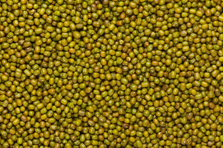 Close up of Organic green Gram (Vigna radiata) or whole green moong dal Full-Frame Background. Top...