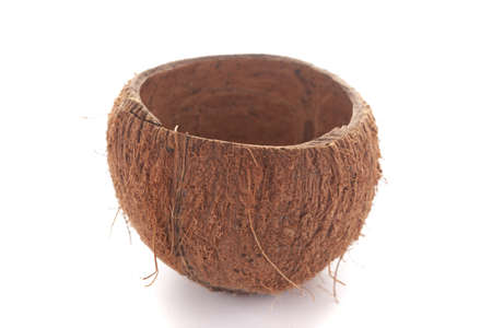 close-up of empty coconut shell bowl over white background.の写真素材