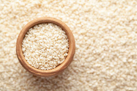 Macro Close-up of Organic White  Sesame seeds(Sesamum indicum) polished or white Til without shell...