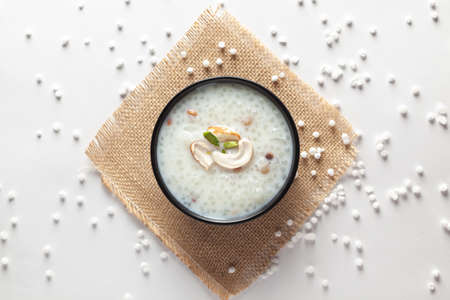 Close-up of Creamy Sabudana Kheer Garnished with dry fruits. Indian delicious dessert. Served in the...