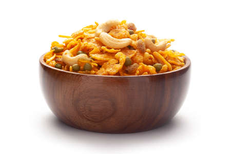 Close up of corn flex mixture Indian namkeen (snacks) In hand-made (handcrafted) wooden bowlの写真素材
