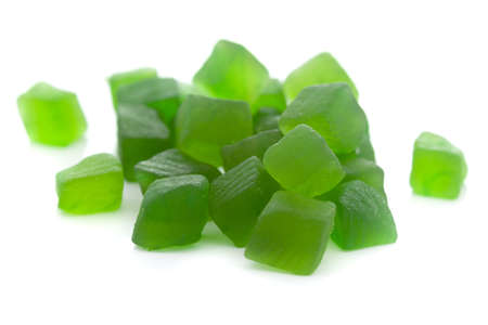 Micro close-up and details of Organic Indian green tutti frutti sweet soft candy  isolated over white background.の写真素材