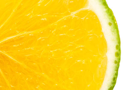 Extreme Close-up of Organic Indian Citrus fruit sweet limetta or mosambi (Citrus limetta) with its sliced part , it is an green and yellow in color, isolated over white background,の写真素材