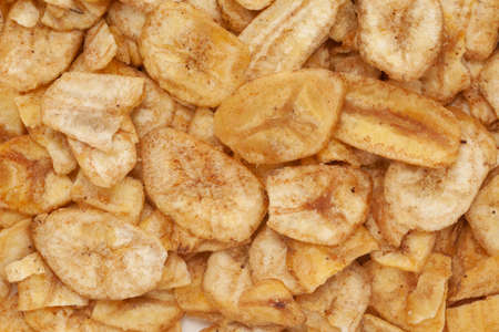 Close-up of Crunchy salty banana chips Full-frame wallpaper, made fried banana  Indian spicy snacks (Namkeen),の写真素材