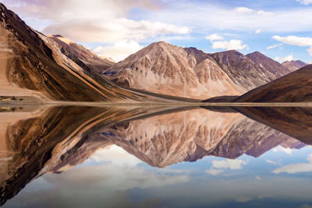 The reflection of mountain on the water.の写真素材