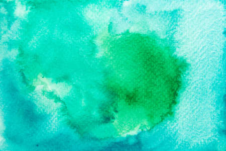 Hand painted green watercolor on paper background.の写真素材