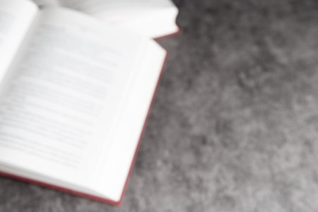 Blurred open book background with copy space.