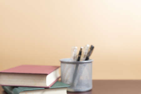 Blurred background od books and stationery items.の写真素材