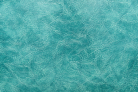 Green leather texture background.  Blank wallpaper for your design.の写真素材
